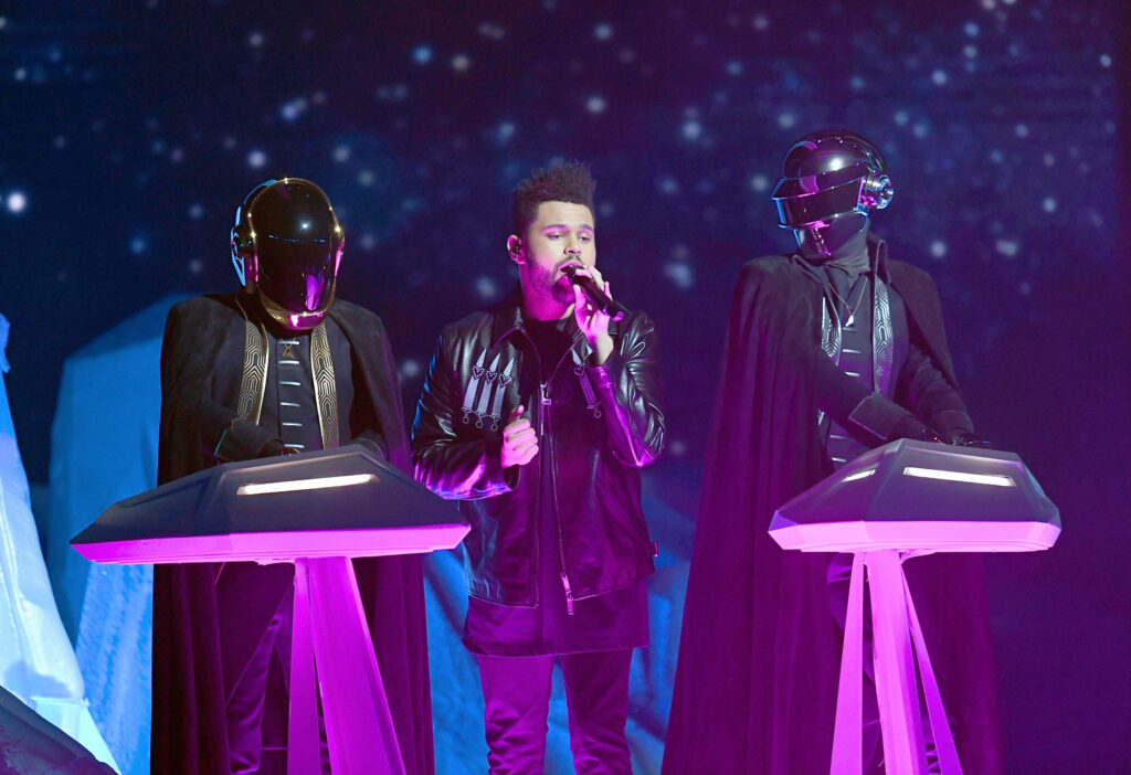 The Weeknd and Daft Punk seen performing "I Feel It Coming" together at the 2017 Grammy Award show